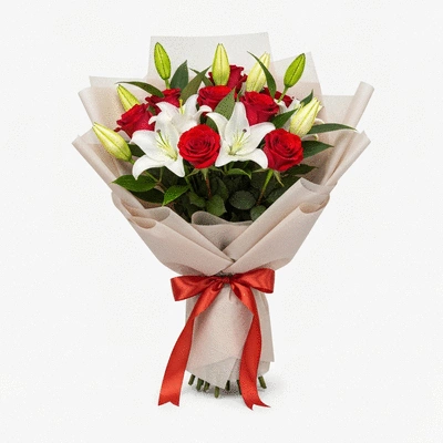 Bouquet de fleurs coloré avec des roses et des lys, emballé élégamment pour la livraison