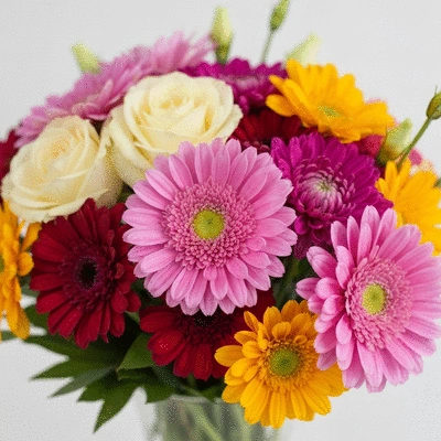 Close-up of a vibrant, fresh bouquet of mixed flowers, with a focus on texture and color